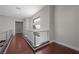 Upstairs hallway features wood floors, contemporary metal railings, and modern design at 88 Pristine Glen St, Las Vegas, NV 89135