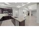 Open concept kitchen with a spacious island, granite countertops, and stainless steel appliances at 88 Pristine Glen St, Las Vegas, NV 89135