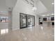 Bright and airy living space with high ceilings, a modern chandelier, and access to the kitchen at 88 Pristine Glen St, Las Vegas, NV 89135
