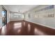 Expansive living room with lots of light, wood floors, and sliding door to backyard at 88 Pristine Glen St, Las Vegas, NV 89135