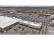 Extensive aerial view of a shopping center with abundant parking surrounded by a thriving community at 8866 Mountain Lion Ave, Las Vegas, NV 89166