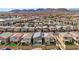 Wide aerial shot of a residential area showcasing neat rows of homes with mountain views at 8866 Mountain Lion Ave, Las Vegas, NV 89166