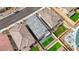 This aerial view captures the house's gray roof, two-car garage and desert landscaping at 8866 Mountain Lion Ave, Las Vegas, NV 89166