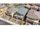 Aerial view showcasing the home's roof, surrounding neighborhood, and proximity to a community playground at 8866 Mountain Lion Ave, Las Vegas, NV 89166