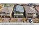 This aerial view captures the house's gray roof, two-car garage and desert landscaping at 8866 Mountain Lion Ave, Las Vegas, NV 89166