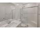 Modern bathroom with glass-enclosed shower, white subway tile, and sleek vanity at 8866 Mountain Lion Ave, Las Vegas, NV 89166