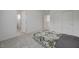 Bright bedroom featuring neutral carpet, white walls, and closet with sliding doors at 8866 Mountain Lion Ave, Las Vegas, NV 89166