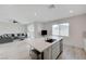 Bright open-concept kitchen with stainless appliances and a view to the living room at 8866 Mountain Lion Ave, Las Vegas, NV 89166
