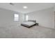 Spacious main bedroom featuring soft carpet, natural light from two windows and neutral paint at 8866 Mountain Lion Ave, Las Vegas, NV 89166