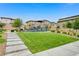 Community park featuring a playground and lush green lawn is perfect for outdoor fun and relaxation at 8866 Mountain Lion Ave, Las Vegas, NV 89166