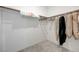 Walk-in closet featuring a rod with clothes and white walls and trim at 8866 Mountain Lion Ave, Las Vegas, NV 89166
