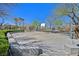 Exterior view of outdoor community basketball court with concrete surface and partial fencing at 8868 Intertwine, Las Vegas, NV 89149
