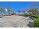 Outdoor community basketball court with concrete surface, trees, and built in seating at 8868 Intertwine, Las Vegas, NV 89149
