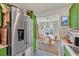 Charming kitchen with stainless steel refrigerator and adjacent dining area at 8868 Intertwine, Las Vegas, NV 89149