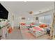 Spacious living room with a large sectional, bright decor, and modern accents at 8868 Intertwine, Las Vegas, NV 89149