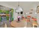 Open living room features bright green cabinets, stainless appliances, and modern decor at 8868 Intertwine, Las Vegas, NV 89149