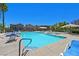Beautiful community pool with lounge chairs and shaded areas, perfect for a relaxing day outdoors at 8868 Intertwine, Las Vegas, NV 89149