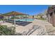 Inviting community pool with shaded lounge area and well-maintained surroundings, offering a relaxing and social space at 8868 Intertwine, Las Vegas, NV 89149
