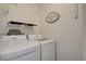 Convenient laundry room with modern washer and dryer set, plus additional shelving for storage at 9000 Las Vegas Blvd # 2060, Las Vegas, NV 89123