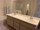 Bathroom featuring a double sink vanity with lots of counter and storage space at 9126 Haddington Ln, Las Vegas, NV 89145