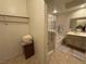 Bathroom with cabinet, enclosed shower and organized closet with shelves at 9126 Haddington Ln, Las Vegas, NV 89145