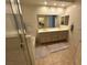 Bathroom with double vanity, tile flooring, and glass-enclosed shower at 9126 Haddington Ln, Las Vegas, NV 89145