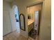 Neutral powder room features a single sink vanity with a mirror, and tile flooring at 9126 Haddington Ln, Las Vegas, NV 89145