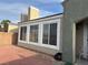 Home exterior with a brick patio and stucco siding at 9126 Haddington Ln, Las Vegas, NV 89145