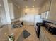 Efficient kitchen layout featuring granite counters and tile flooring at 9126 Haddington Ln, Las Vegas, NV 89145