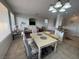 Bright, open-concept living room and dining area with tile floors at 9126 Haddington Ln, Las Vegas, NV 89145