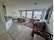 Inviting living and dining room area with tile floors, lots of light and a great view from the many windows at 9126 Haddington Ln, Las Vegas, NV 89145