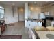 Open-concept living space featuring kitchen, dining area and living area with natural light and modern finishes at 9126 Haddington Ln, Las Vegas, NV 89145