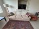 Comfortable living room showcasing a stylish couch, textured rug, and decorative elements at 9126 Haddington Ln, Las Vegas, NV 89145