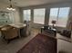 Living and dining room area boasts tile floors, great light, and fantastic view from the many large windows at 9126 Haddington Ln, Las Vegas, NV 89145