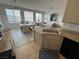Open-concept living room and dining area features tiled flooring and ample sunlight at 9126 Haddington Ln, Las Vegas, NV 89145