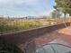 Beautiful outdoor patio area with block wall and landscaping at 9126 Haddington Ln, Las Vegas, NV 89145
