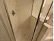 Tiled shower with glass enclosure and chrome fixtures at 9126 Haddington Ln, Las Vegas, NV 89145