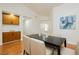 Dining area showcasing hardwood floors, modern table, and built-in storage at 9741 Horizon Hills Dr, Las Vegas, NV 89117