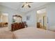 Bright bedroom offering a spacious interior design, adjoining rooms, and comfortable carpet at 980 Aspen Cliff Dr, Henderson, NV 89011