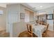 Bright dining area with tile floors, a dining set and large window at 980 Aspen Cliff Dr, Henderson, NV 89011