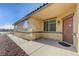 Home exterior featuring a front door with a porch and desert landscaping at 980 Aspen Cliff Dr, Henderson, NV 89011