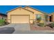 Charming one story home with an attached two car garage and desert landscaping at 980 Aspen Cliff Dr, Henderson, NV 89011
