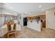 Bright kitchen and dining area with tile floors and wood cabinetry at 980 Aspen Cliff Dr, Henderson, NV 89011