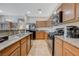 Updated kitchen boasting granite countertops and stainless steel appliances at 980 Aspen Cliff Dr, Henderson, NV 89011