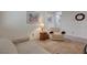 Comfortable living room setting with a sofa and cushioned chair at 980 Aspen Cliff Dr, Henderson, NV 89011