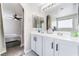 Bathroom features double sinks, modern vanity, and an arched doorway to the bedroom at , Las Vegas, NV 89149