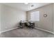 Neutral bedroom with a desk and chair set up, ready for work or study at 7940 Violet Dawn St, Las Vegas, NV 89149