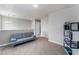 Cozy loft area with carpet and a comfortable gray couch at , Las Vegas, NV 89149