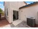 Enclosed back patio with sliding glass door features an air conditioning unit at 7940 Violet Dawn St, Las Vegas, NV 89149