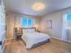 Inviting bedroom with large windows, soft natural light, and a comfortable king-sized bed at 10768 Ditchburn Ct, Las Vegas, NV 89166